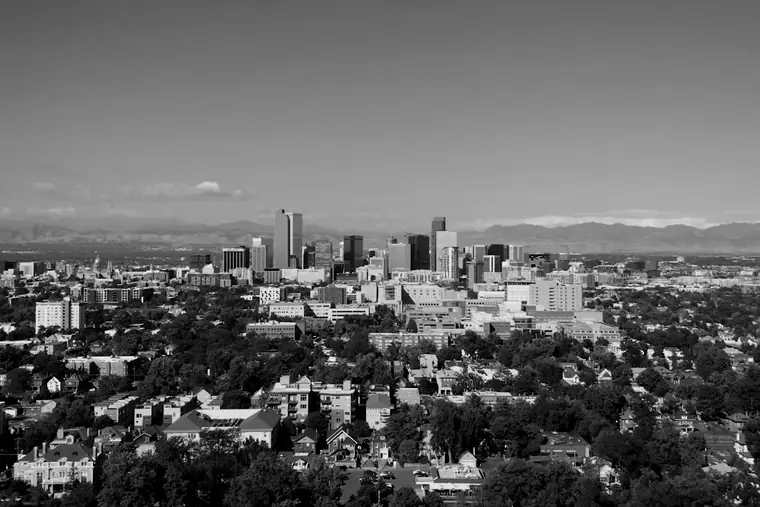The downtown Denver skyline with the Rocky Mountains in the distance