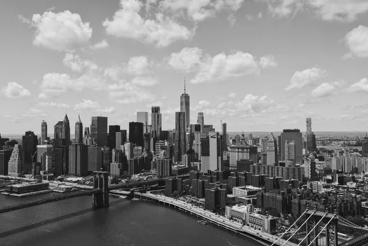 The Lower Manhattan skyline and the Brooklyn Bridge over the East River in New York City