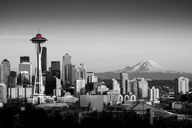 The Space Needle and the Seattle skyline with Mount Rainier in the distance
