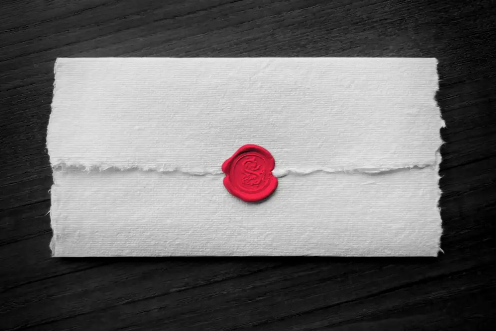 An envelope closed with a red wax seal, a symbol of a formal, signed assurance