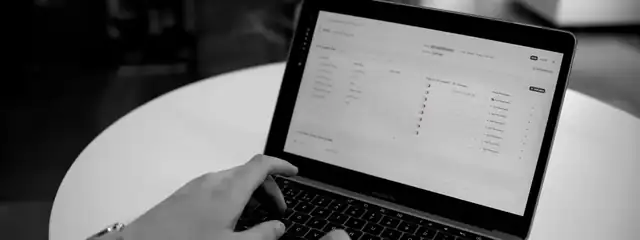 A laptop showing a security questionnaire spreadsheet